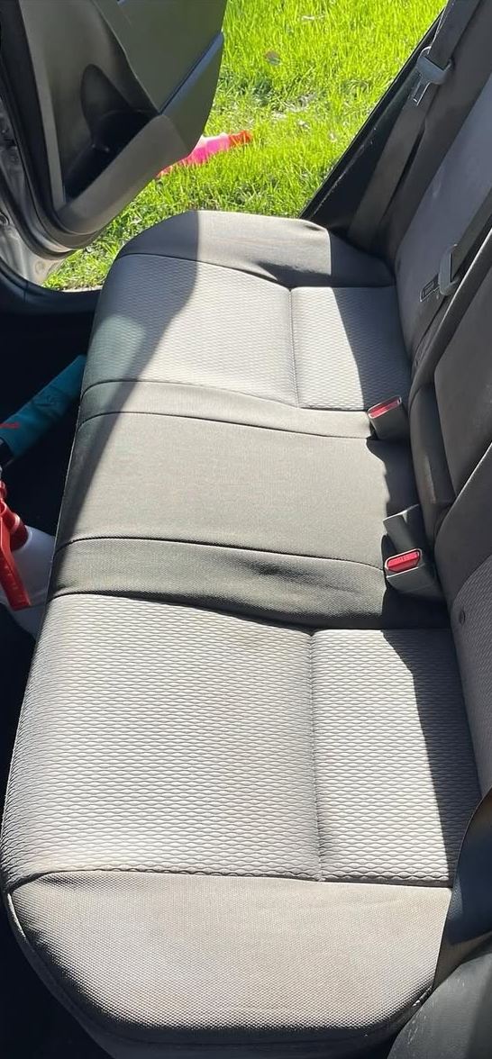 After: the same rear seat clean with the stains removed